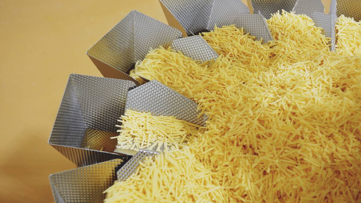 The automated process cuts 20kg cheese blocks into consumer-sized blocks, slices and shredded packages.