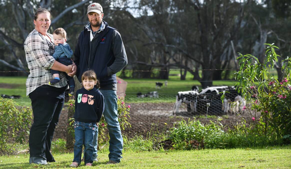 GOOD NEWS: Greta dairy farmers Brooke and Justin Evans, with their children Fairlie and Henry. Mr Evans welcomed the ACCC announcement. Picture: MARK JESSER