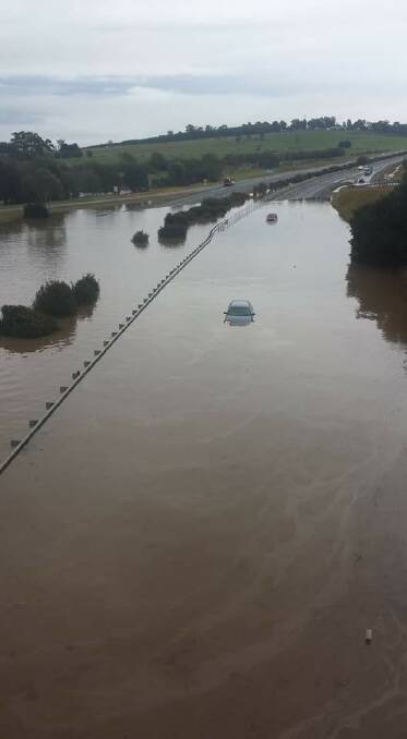 The Westbury overpass on the Bass Highway is underwater. Picture: Natasha Mundy