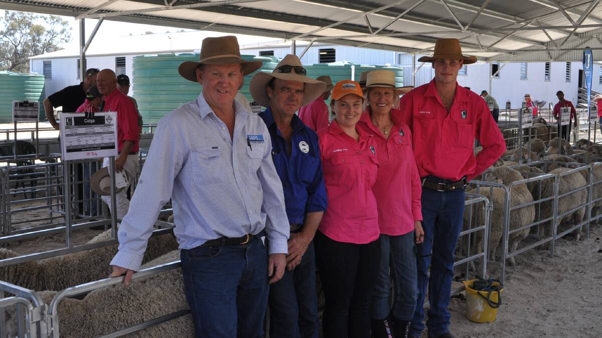 Ed Lilburne, Hay Plains Livestock, with purchaser of top-price ram Ed Rees, Paneena Pastoral Co., Ivanhoe, and Georgie, Margie, and Sandy Pye, Calga/Uardry Dohnes.
