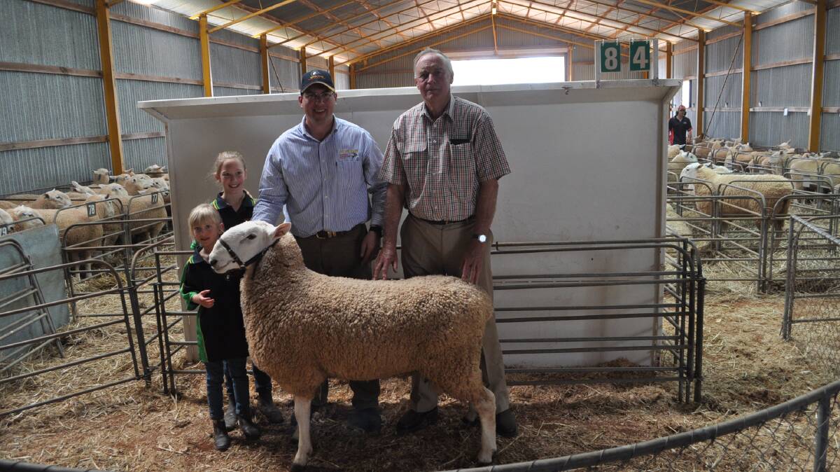 Purchasers of equal top-price ram for $6000 the Sutton family, Wattle Farm Border Leicester stud, Temora, Christine (7), Elizabeth (9), and Jeff with Barry Harper, Cadell Border Leicesters.