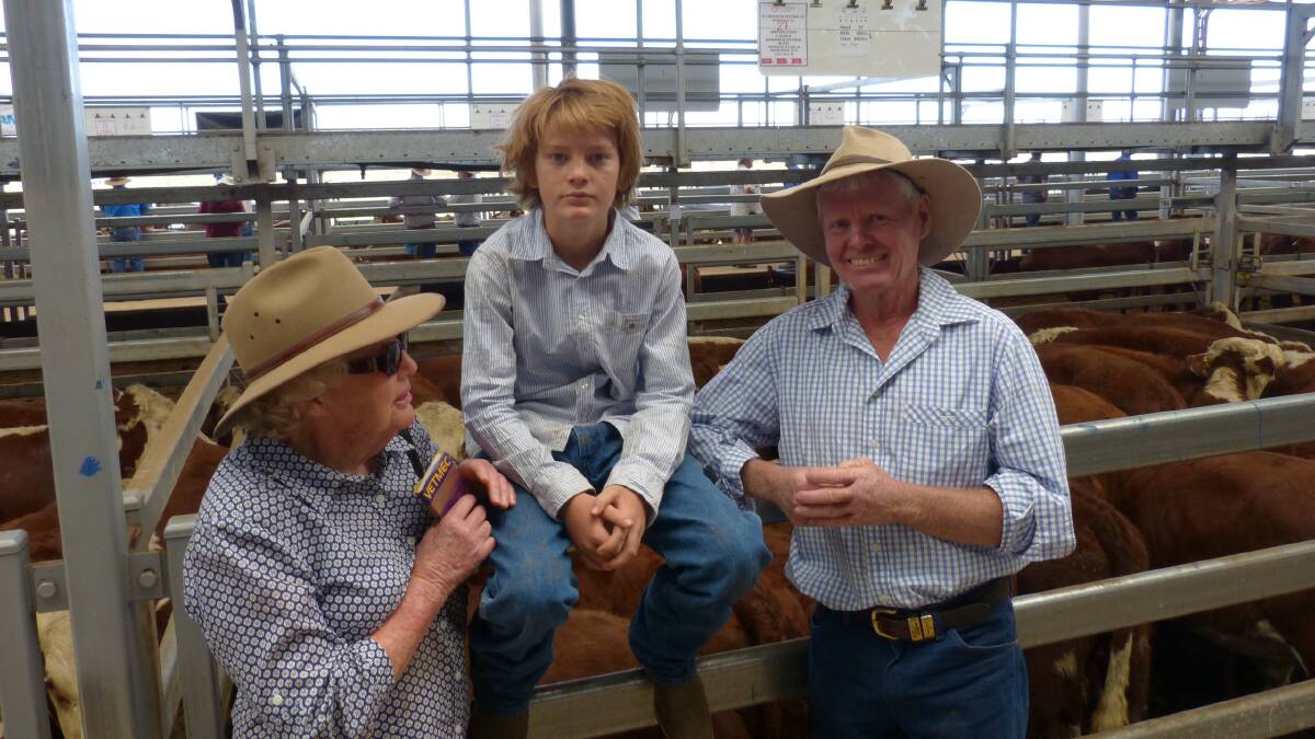 Tony Reardon, Brooklyn Pastoral Company, Mansfield, with son Tom, and mother Margo, with their top pen of Hereford steers at Barnawartha, Wednesday. These steers, 358kgs, sold for $1145.