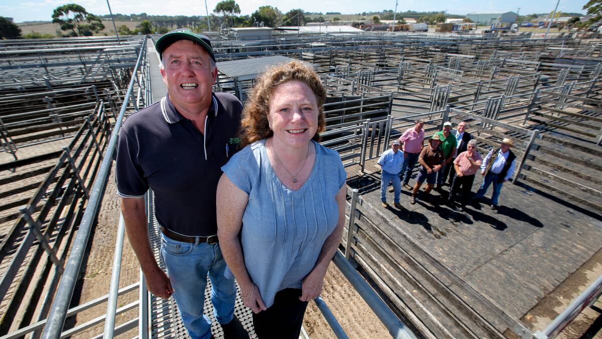 Warrnambool Stock Agents Association president Jack Kelly, Warrnambool mayor Kylie Gaston and other local livestock agency and council representatives (in background), declare their organisations' continuing support for the Warrnambool saleyards. Picture: Rob Gunstone