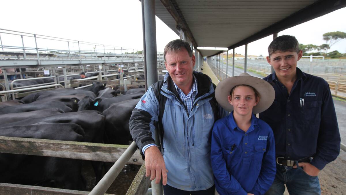 Top price: Seller of the $3025 top priced pens of heifers and calves Darren Askew, left, of Mindarra Park, Benalla,  with his son Harrison and staff member Josh Hewitt.