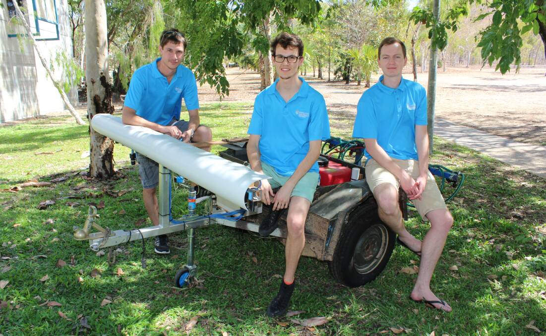 Alex Olsen (far right) with technicians Brendan Calvert and Jake Wood on an early stage prototype carrying the rangeland weed seeking system.