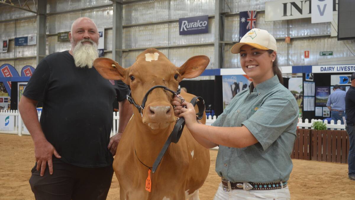 Kevin Gass, Corriemungle,with the record-breaking Guernsey heifer at $16,000 and handler Kyella McKenna.