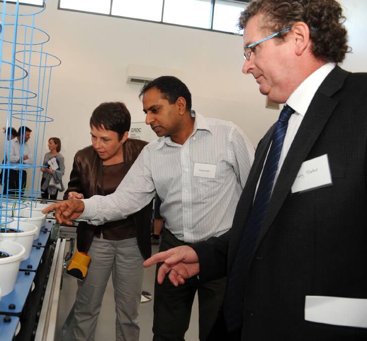 Building a future: Surya Kant points out features of the Plant Phenomics Victoria centre to Jaala Pulford and Tony Slater. Photo: Paul Carracher