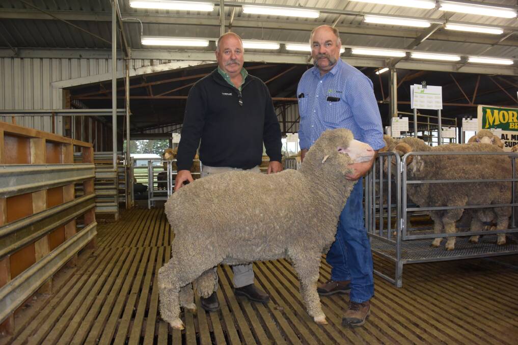 Landmark's Kevin Beaton and Coryule Manager Craig Trickey with the top price Poll ram sold to David & Michelle Elsom.