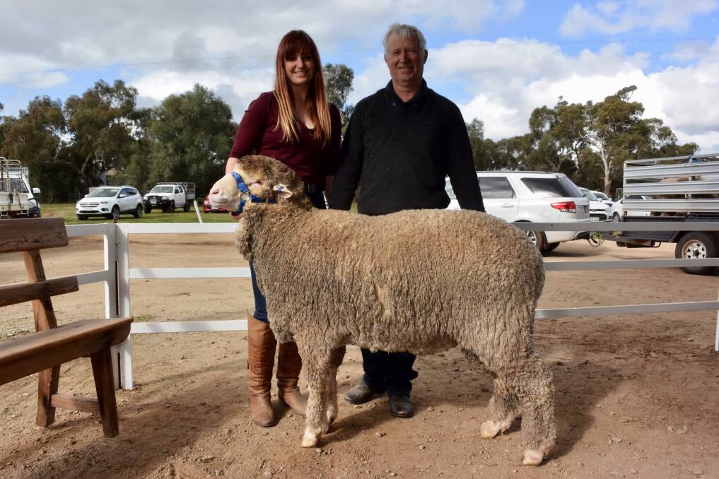 Claire McGauchie, Terrick West, and Kevin Crook Tamaleuca, Ouyen, with the equal top priced ram which sold for $4500.