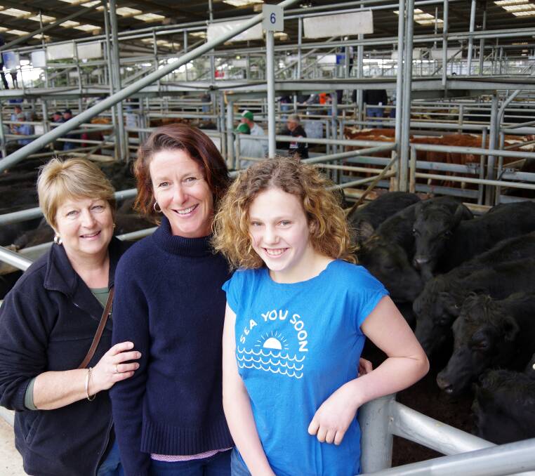 A line of 2yo Black Mountain Angus steers sold to $1810. Watching the sale were station manager Margaret Rogers and owners Helen and Meg (12) Nixon.