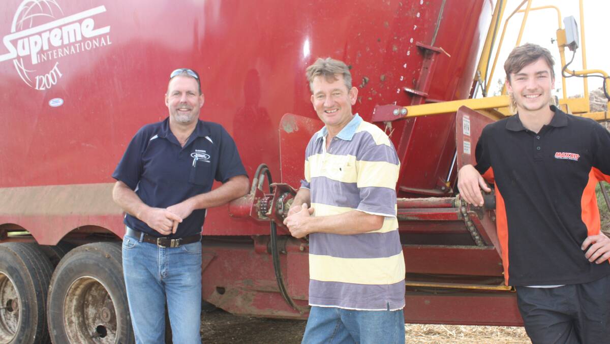 Bunbury Machinery branch manager Darren Pulford (left), discusses the performance of the Supreme 1200T feed mixer with Elgin Dairies director Darren Merritt and his son Chad in WA.