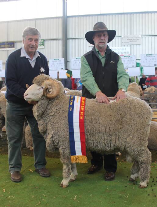 Rob Harding, Glendonald, with the top priced ram which sold for $5500 and John McGrath, Landmark Wool.