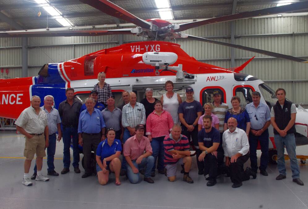 Enormous support: Helimed1 crew Marcus McCole and Paddy Howlett with Gippsland woolgrowers and Helimed1 auxiliary members.