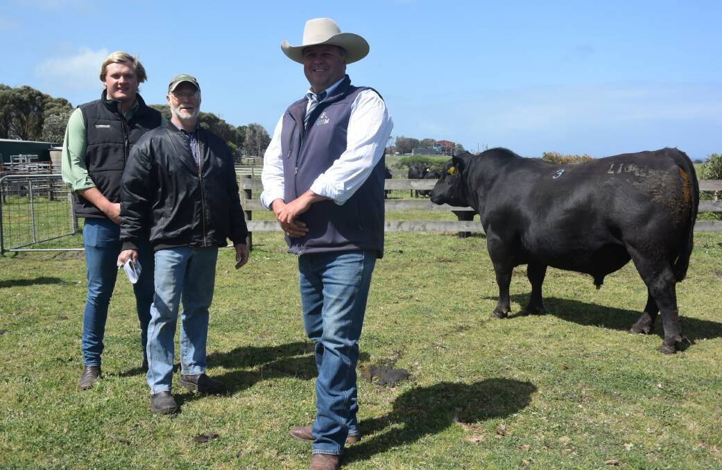 Jack Ginnane, Landmark Leongatha, with Carrich Barter farm manager for McRae Pastoral Inverloch and Michael Glasser, GTSM, with the top priced bull that sold for $8000.