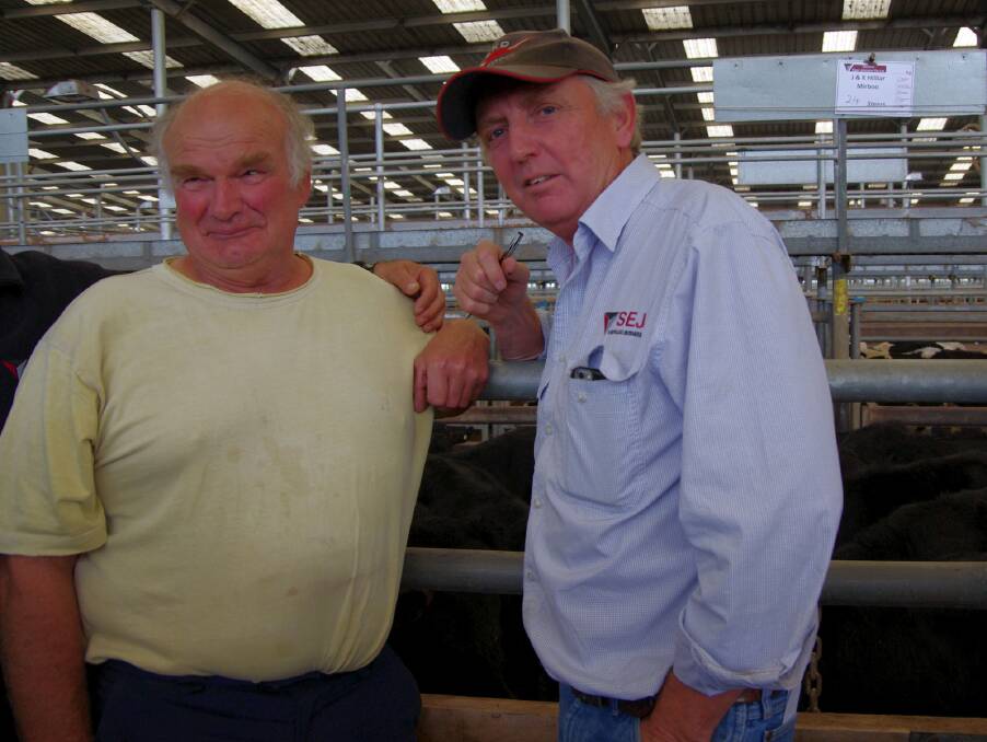 Peter Randall, Welshpool, and Owen Kindellan, SEJ Livestock. Mr Randall bought Angus steers to fatten to bullocks over 12-18 months. 
