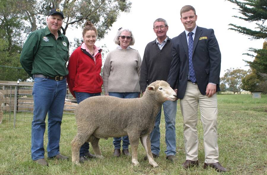 The top price Croydon ram which sold for $1300 with Mike Deppeler (left), Amy Tierney Elders, buyers Heather and Neville Richards, SGL auctioneer Dylan Praolini.