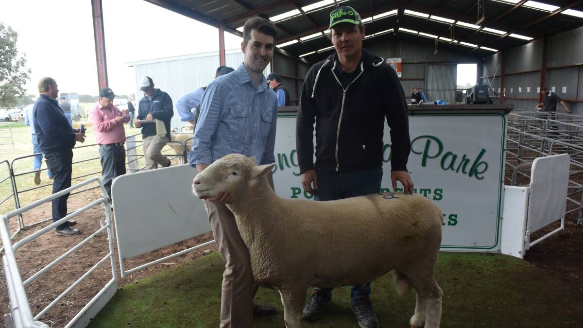 Stephen Oliver from Englewood park with Sam Rundell with top price ram selling for $2400.