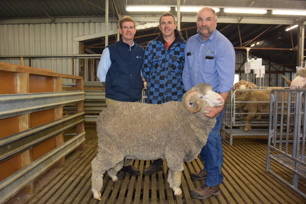 Australian Wool Network's Jason Rothe with Top price buyer Bruce Vowels and Coryule Manager Craig Trickey.