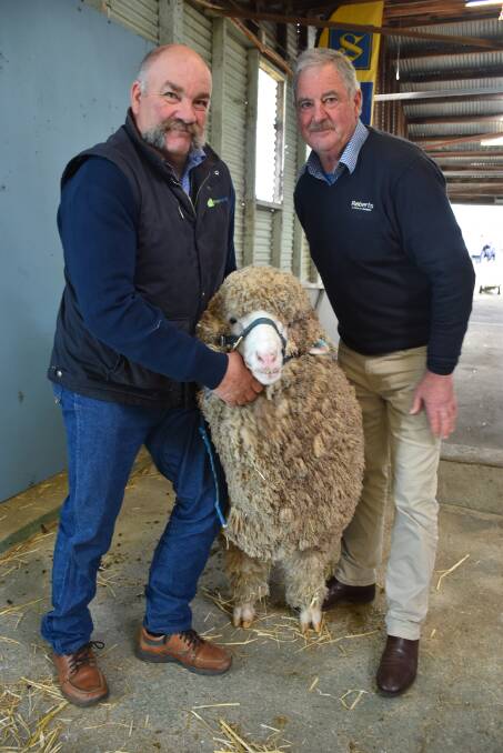 Coryule Merino stud manager Craig Trickey, with Andrew Calvert, Roberts, who purchased the top-priced ram on behalf of Trefusis Merino stud, Ross, Tasmania.