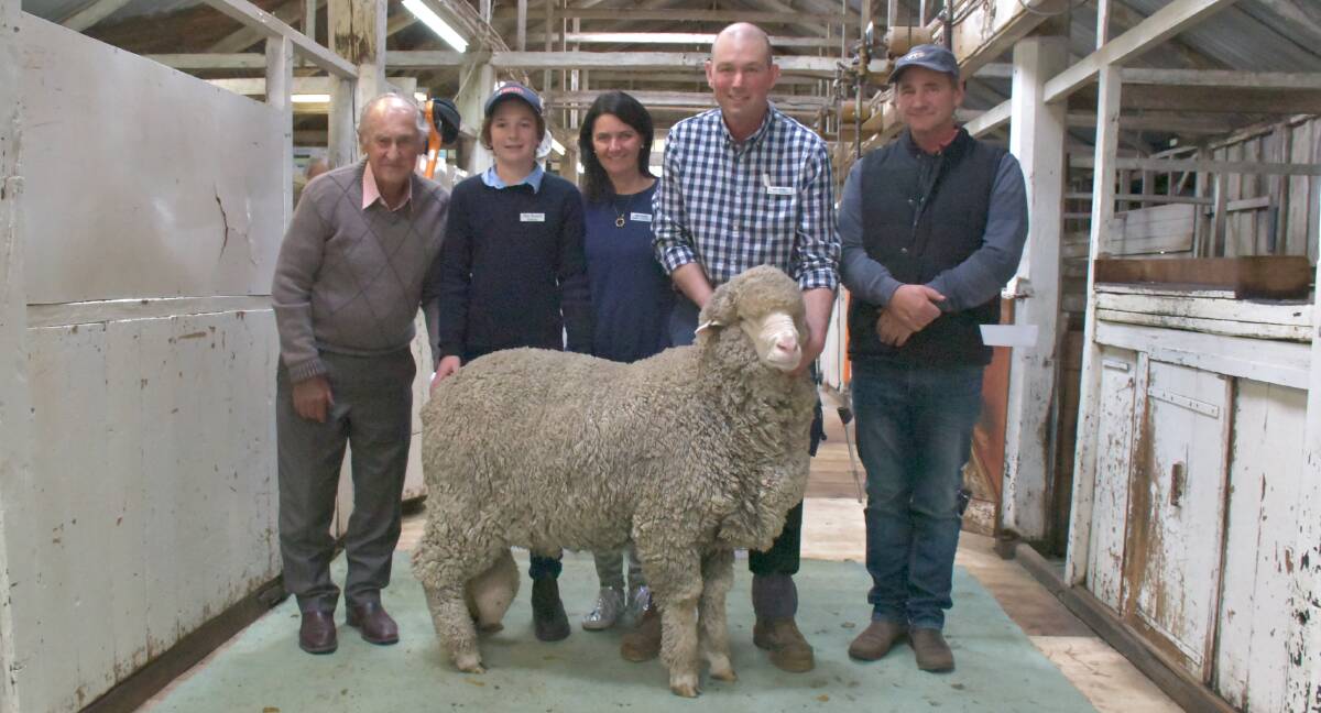 TOP RAM: Buyers Ron and Allan Anderson, Amphitheatre (left and right), with Alex, Emma, and Warren Russell, Melrose Merino stud, and the top-priced ram.