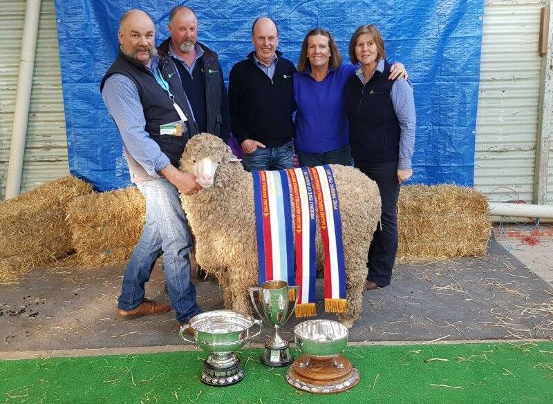 Craig Trickey, Gary McLean, Russell and Tricia Sloan, and Cindy Trickey, Coryule Merino stud, Willowvale, with the supreme champion sheep.