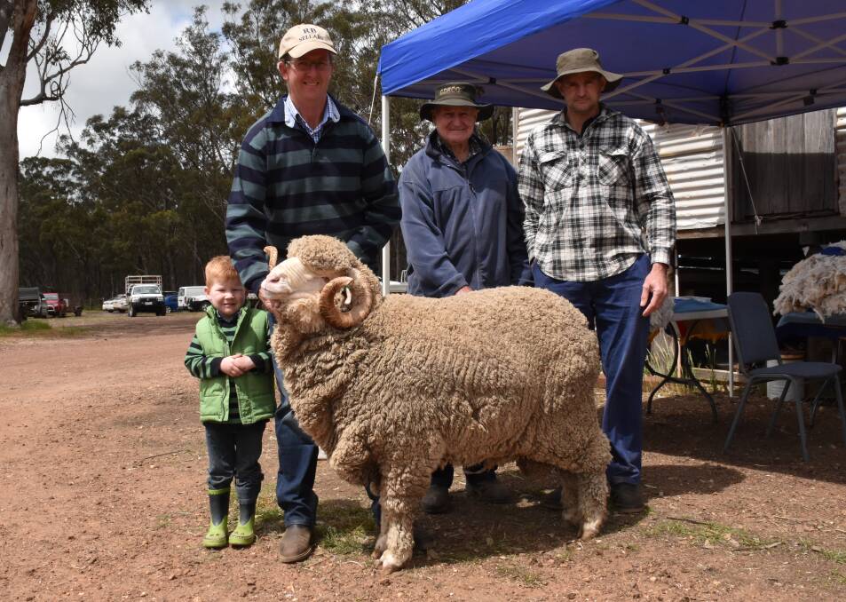 TOP-PRICED RAM: Alan and son Tom Harris, Koole Vale Merinos, and top-priced buyers Lex and Jim Tattersall, Moormbool, with the top-priced ram. This was Koole Vale's first ever on-property ram sale, in which they sold 28 Merinos and 12 White Suffolks, and Mr Harris said he was extremely pleased with the result. Photo: Joely Mitchell.