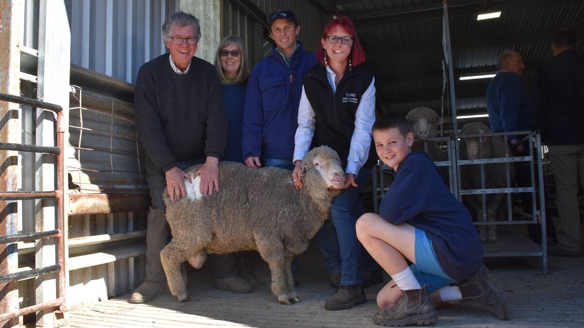 Toland stud principals Phil and Georgina Toland, with top-priced buyer Tim Cavill, 'Fox Pastoral', and Anna Toland and Charlie Thompson, 10, and the top-priced ram.