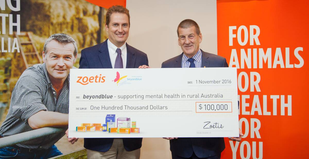 SHOWING SUPPORT: Zoetis general manager Lance Williams presents a $100,000 'cheque' to beyondblue chairman Jeff Kennett, to support mental health in rural communities.