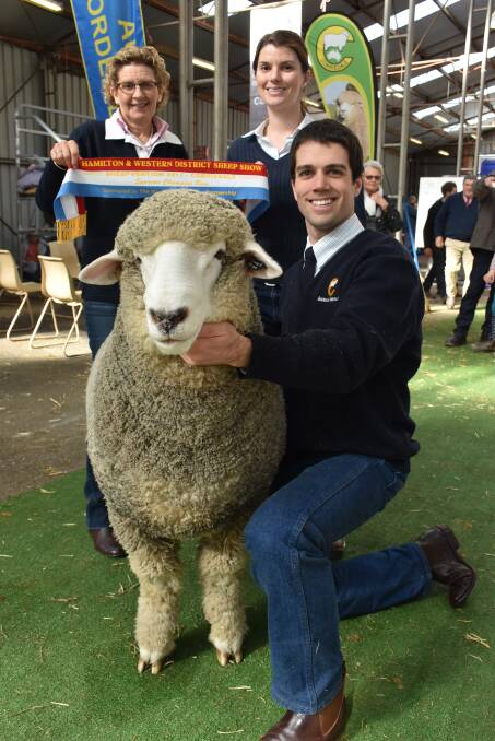 Bron Ellis, Casey Tomkins, and Leigh Ellis, Sweetfield Corriedale stud, Mount Moriac, with their champion ram.