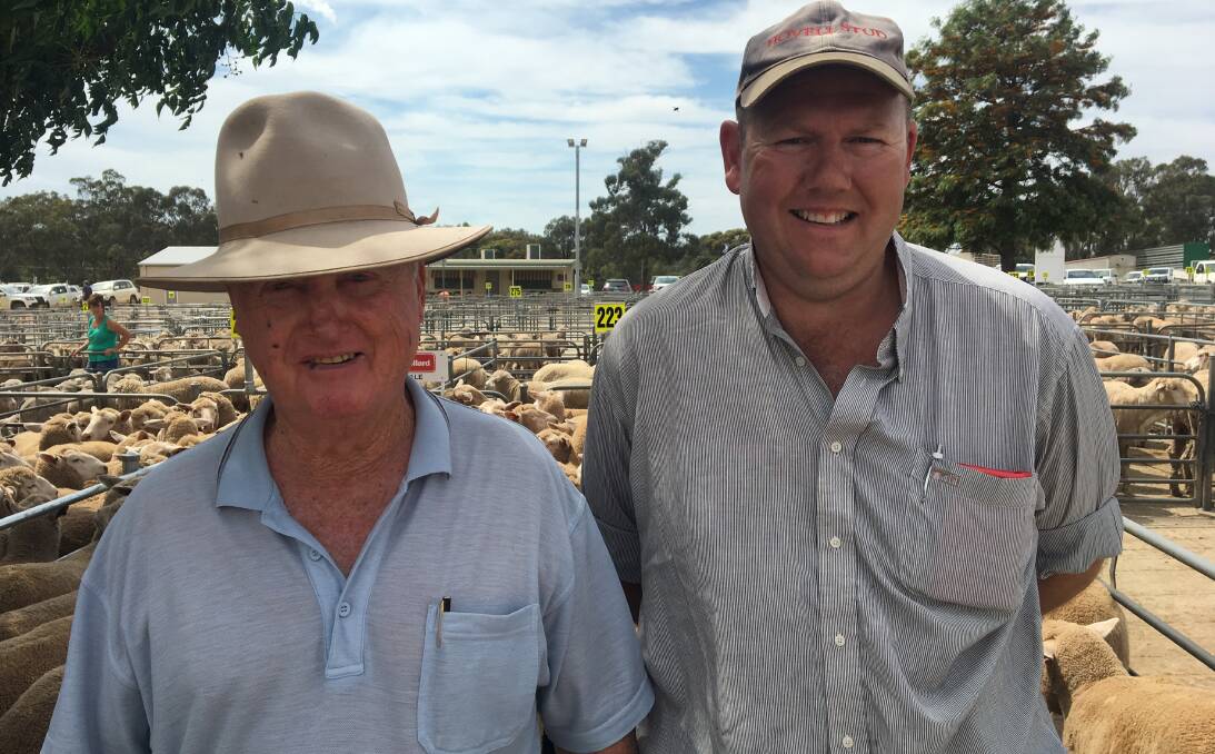 SOLD: Peter Mellington with Warren Hall from Burrumbuttock, who sold 135 shorn lambs at $153 at Corowa. Like many markets to the north, numbers there were down significantly and quality varied throughout the sale. 