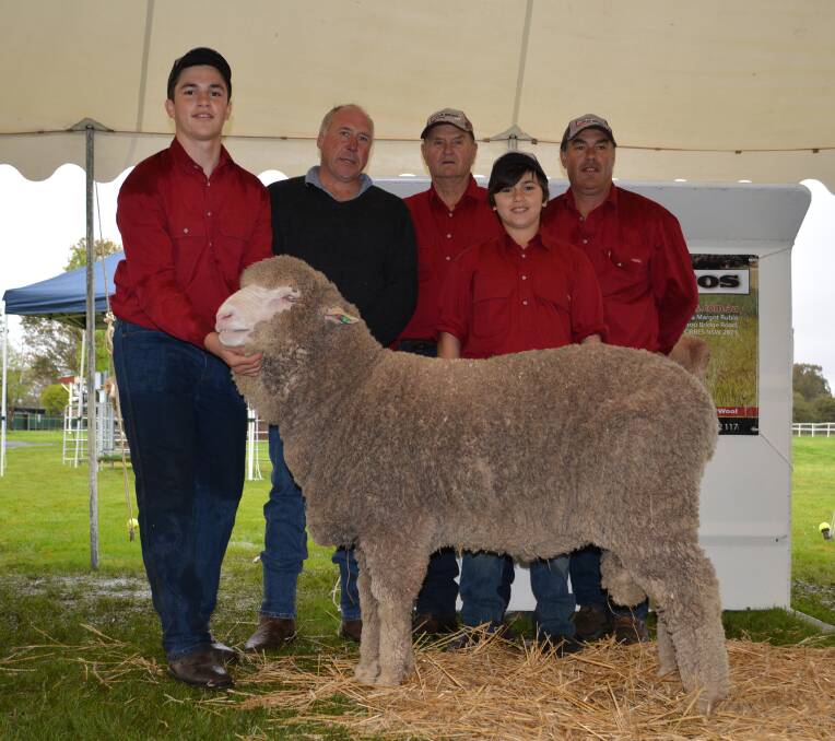 Buyer Adrian O’Keefe, Bungoona Merino stud, Molong, with the Rubie family, Mitchell, Campbell, Kevin and Glen. 