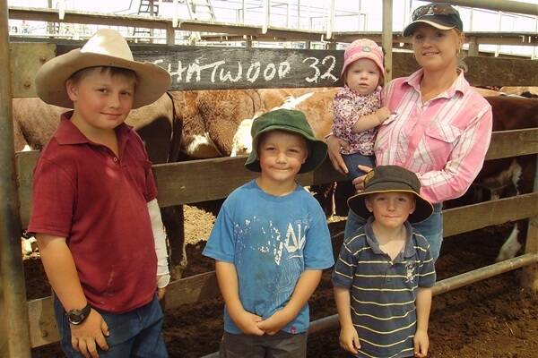 Hayden, Jacob, William, and Kirsty Luck with little baby, Lillee Cook, at Roma’s Store Sale in Tuesday. The Luck family sold a line of Hereford-cross heifers through Landmark Roma.