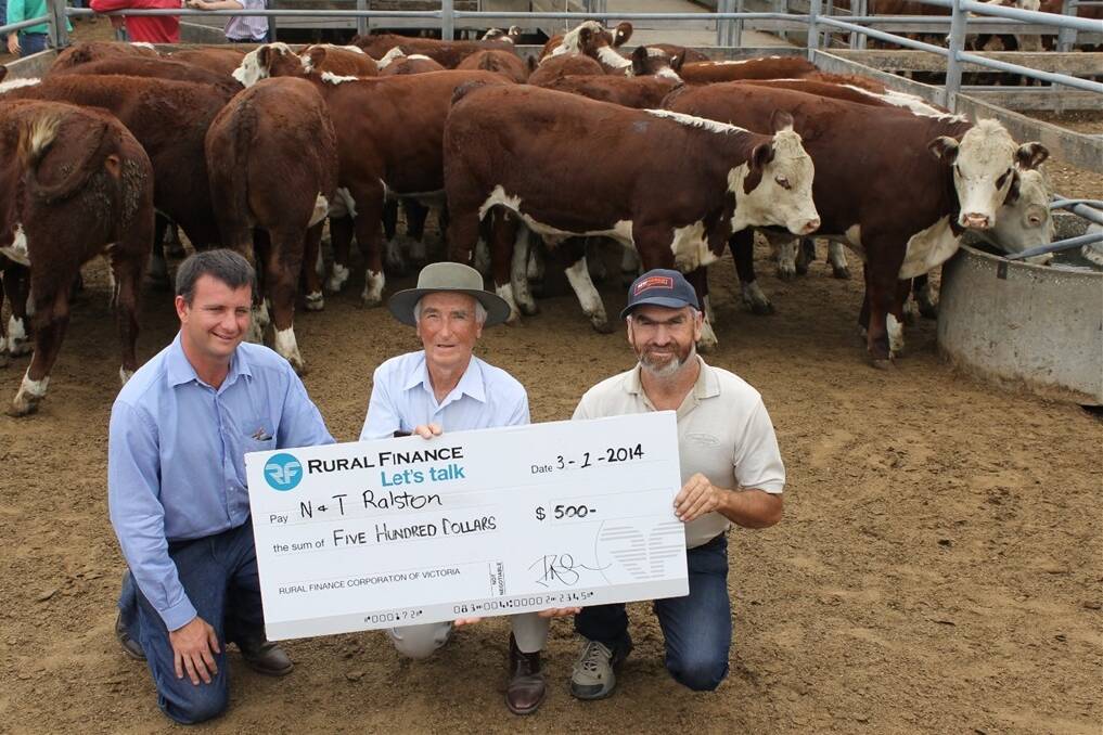 Winners of the Rural Finance best presented pen of weaners, Neil and Trevor Ralston, Hollywood, Euroa, with Rural Finance's Mark Hodge (on right). They sold the best presented pen at 200c/kg.