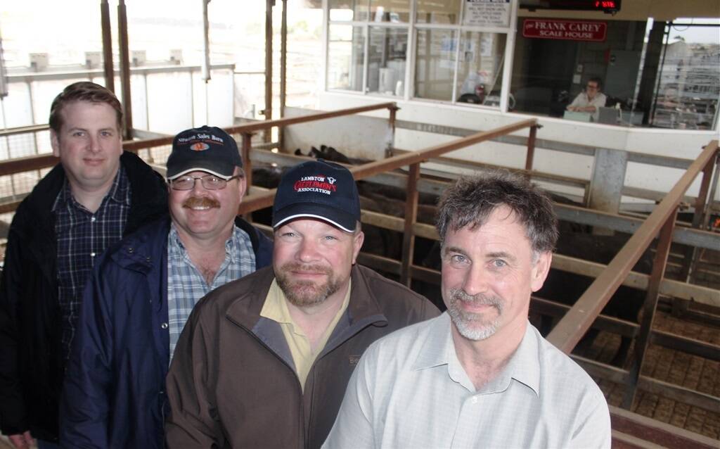 Beef Farmers of Ontario director Cory Van Groningen, vice-president Matt Bowman, director Tim Fugard and Ministry of Agriculture and Food director George McCaw at the Warrnambool saleyards.