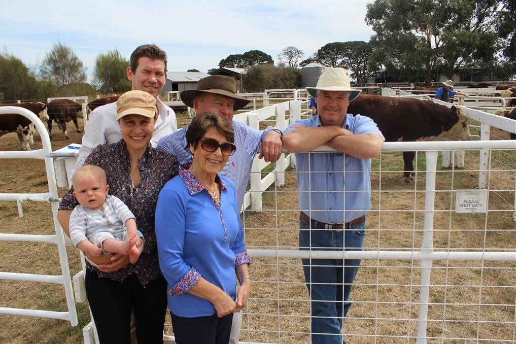 Jonathon and Jo Jenkin with baby Leo, David and Judi Jenkin and Andrew Bell with the top priced $6500 bull.