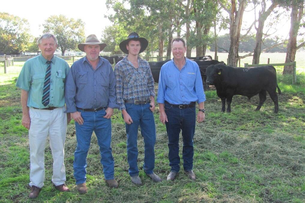 Landmark stud stock auctioneer Andrew Sloan (left) with top price buyers Brian and Michael Higgins and Pinora Angus principal John Sundermann with the top price bull which sold for $10,500.