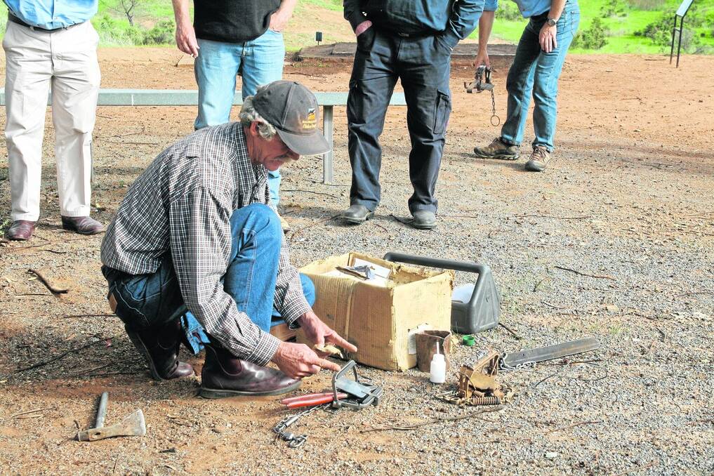 GUN TRAPPER: Alan Ireland, Narinna Station, demonstrates trap setting at the Orroroo wild dog workshop last Wednesday.