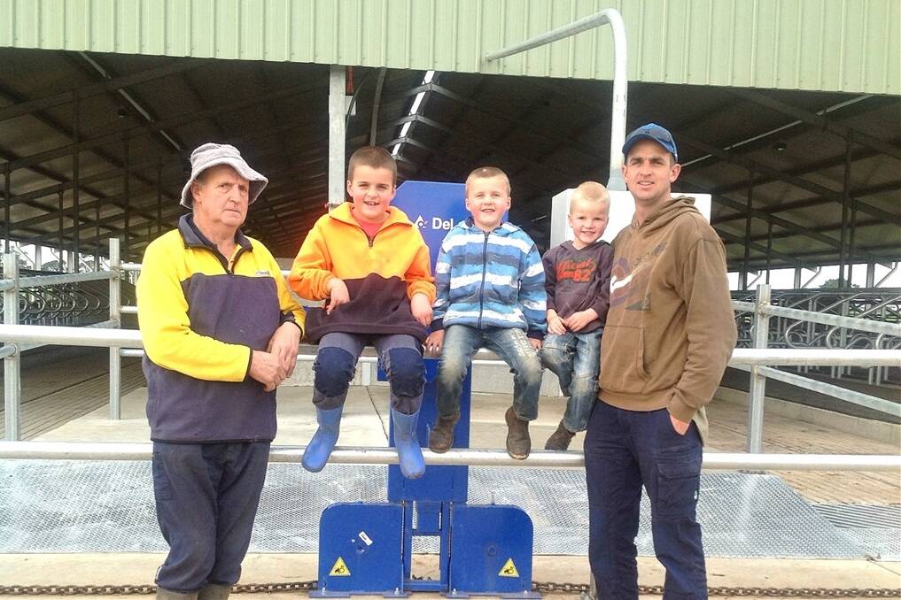 Mark Trigg (left) with his father Ron (right), and Mark's children Rylan, Rhys and Billy, at their Ballarat dairy farm.