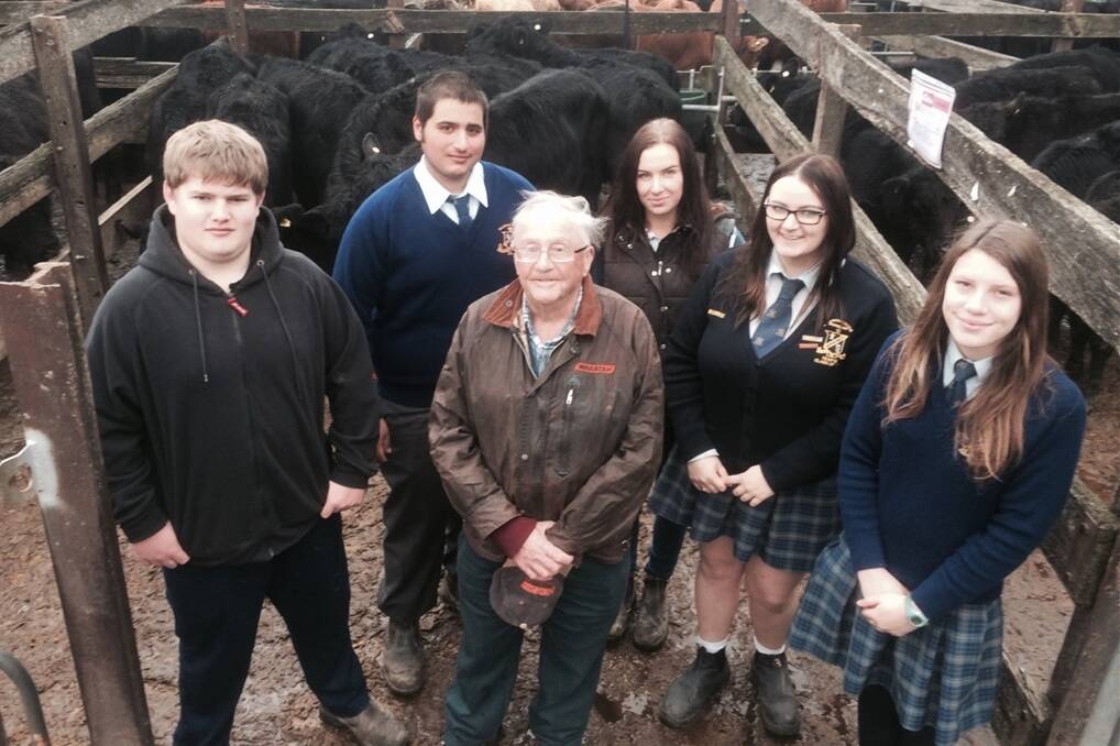 Salesian College students Josh, Ben, Emily (farm worker), Emma and Nellie attended Kyneton sale and sold a line of Angus spring-drop weaners they bred and raised as part of their Certification 2 Agricultural course. They are pictured with a buyer of the steer portion Robert Green of Lancefield who paid $465 for a pen of 12.