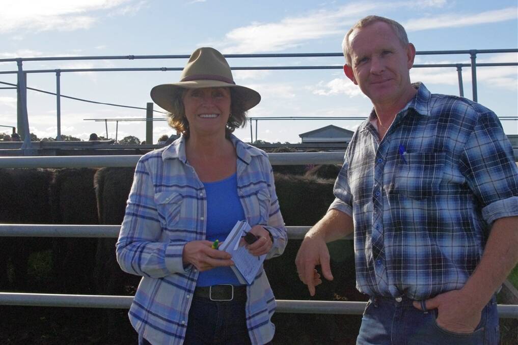 Gail Hoekstra, of Myrtlebank, bought two pens of heifers at the Truro Angus dispersal sale last Friday, paying up to $660. She will add them to the cows she already uses to breed vealers. Ms Hoekstra is pictured with Jamie Austin of Sale.