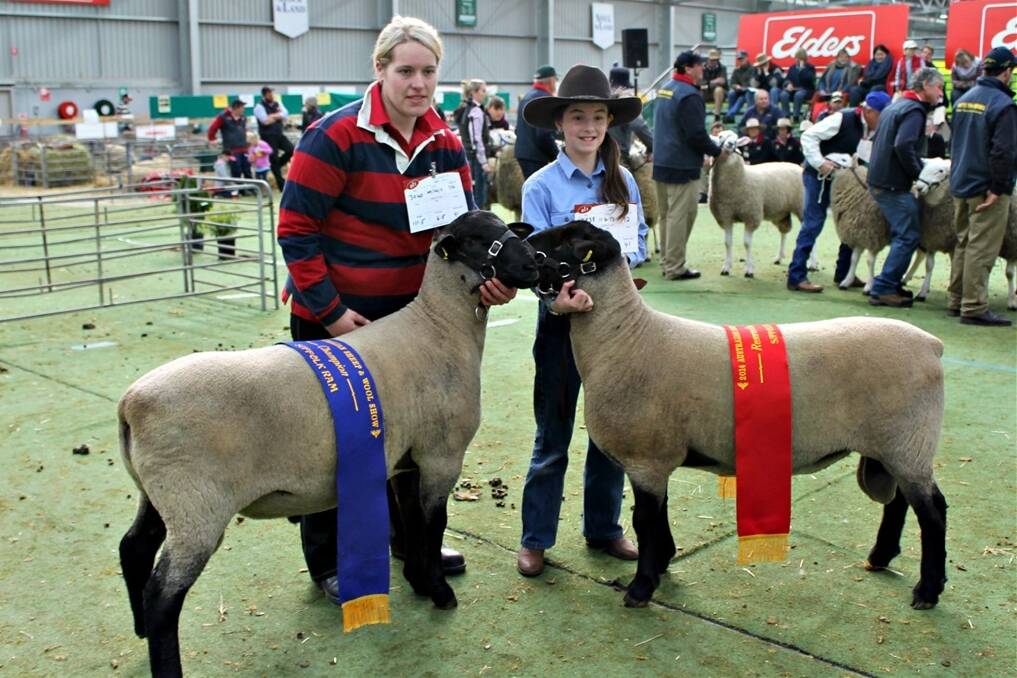Rebecca Deppeler with the Deppeler stud's champion ewe and Charlotte Close with Closeup Suffolks' August drop ewe that was named reserve champion.