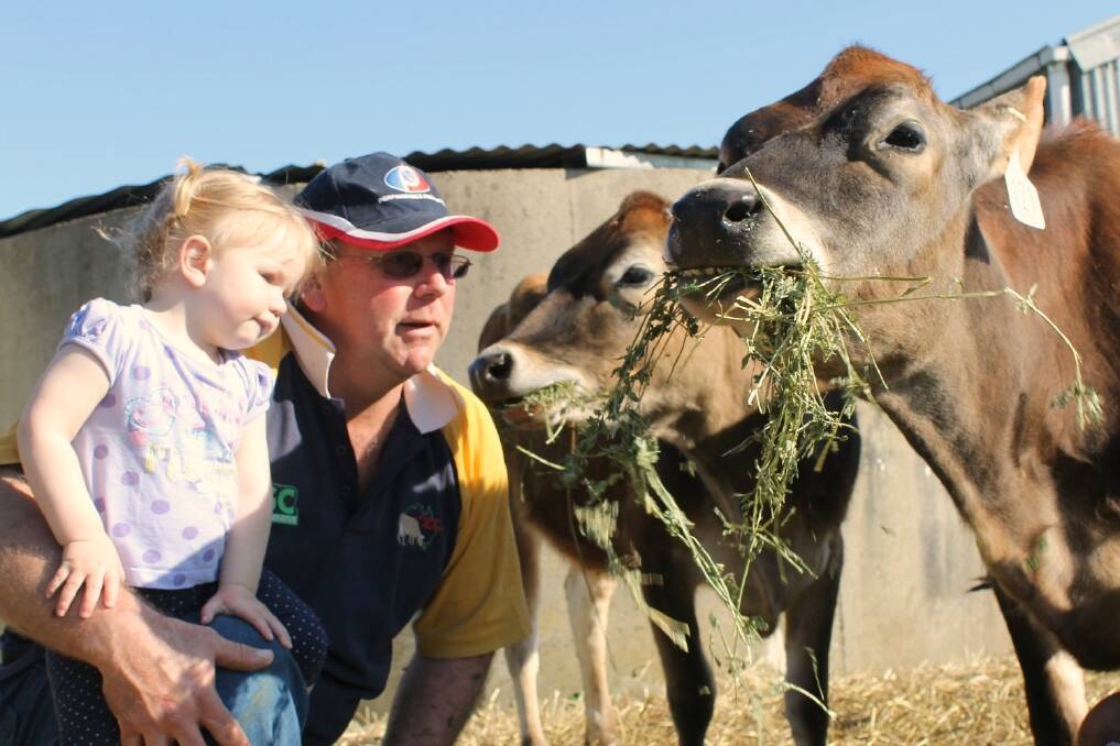 Will Rundle, pictured with his daughter Caitlin, 18-months, and the Boggabilla show team on the family’s Ecklin South farm.