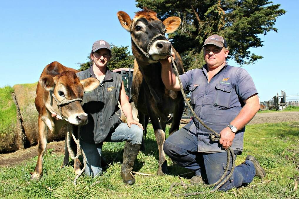 Simon Reid and Belinda Egan on their Garvoc farm with a few of the show team that will make the trip to the Royal Melbourne Dairy Show this weekend.