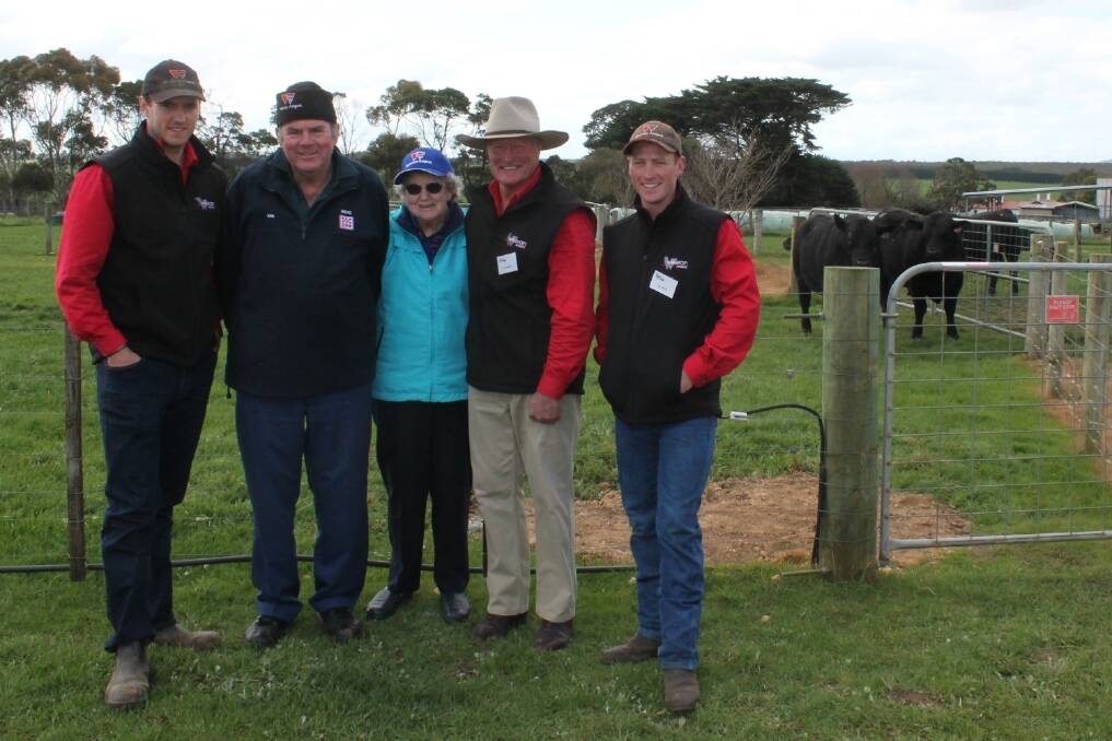 Marie Sheedy (middle) and son Ken Shone (second from left) of Nudgee Angus, North Cundare, bought the top-price bull Weeran Holt (pictured) for $8000. They are with Weeran Angus’ Tom French, principal Alec Moore and Tim Wright.