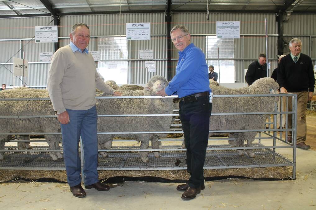 Ken Hausler and vendor Noel Henderson with the top-priced ram.