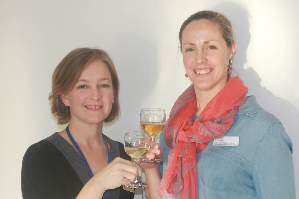 Drs Anna Carew and Fiona Kerslake, of the Tasmanian Institute of Agriculture, in Launceston, toast the success of Tassie cider.