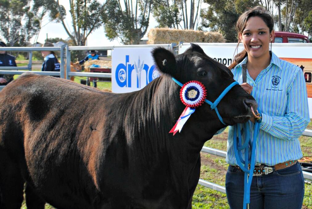 First-year Advanced Diploma of Agriculture student at Longerenong College, Lakeisha Spain, Tasmania, with the grand champion carcase steer.