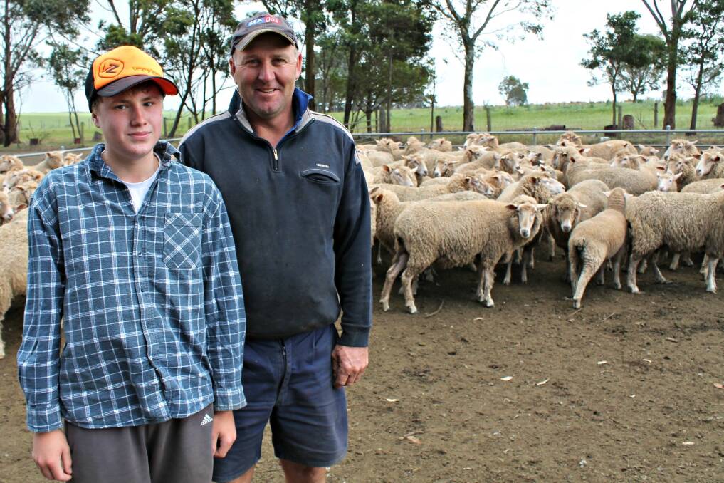 Greg Holcombe and nephew Nathan Uebergang inspect their BLM ewes with August lambs at-foot.