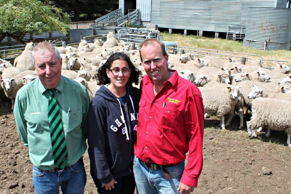 Landmark Mortlake agent Garry Whitehead, Lisa and Steve Parker of South West Genetics with the 121 Coopworth ewes sold to $152.