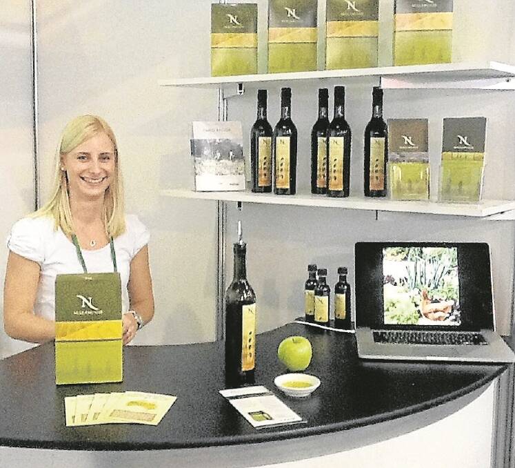 Katherine Paterson at Tongio. Nullamunjie extra virgin olive oil is packaged in the bottle and cask for the local market and in bulk for the overseas market.